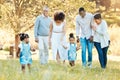 Nature, happy and family generations in a park for bonding, having fun and talking together. Love, smile and children Royalty Free Stock Photo