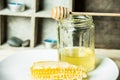 Nature and health - honey and spoon with honey and honeycomb isolated on rustic background