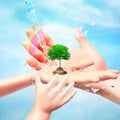 Nature in human hand. The concept of environmental protection. Template for your design with hands, tree, birds, water jets and Royalty Free Stock Photo