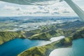 Nature in Iceland, volcanic mountains and lakes in highlands from small airplane