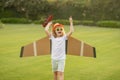 Nature and kids lifestyle. Dream of flying. Little children with toy airplane in a field at sunset. Success and child Royalty Free Stock Photo