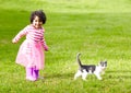 Nature, kitten and girl playing in a garden on the grass on a summer weekend together. Happy, sunshine and portrait of Royalty Free Stock Photo