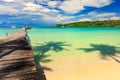 Nature landscape: Amazing sandy tropical beach with silhouette coconut palm tree in crystal clear sea and scene Royalty Free Stock Photo