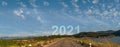 Nature landscape with asphalt road leading forward to happy new year 2021.