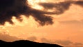 Black Clouds and Mountains under Sunset Royalty Free Stock Photo