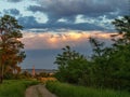 Landscape nature clouds sky vegetation trees evening sunset forest road wide trail winding clouds before the storm