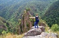 Nature landscape. Girl slipped while standing on the edge of a cliff