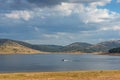 Nature landscape with lake and fishing motor boat