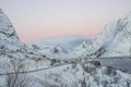 Nature landscape mountain range full of snow with road in Reine at dawn in winter in Lofoten Islands Royalty Free Stock Photo