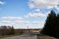 Nature landscape with road, blue sky and white clouds in a spring or autumn day. Travel and Journey concept Royalty Free Stock Photo