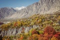 Colorful foliage in Hunza valley against Karakoram mountain range in autumn. Gilgit Baltistan, Pakistan. Royalty Free Stock Photo
