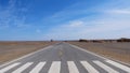 Nature landscape view of straight road in under sunny blue sky in Dunhuang UNESCO Global Geopark, Gansu China