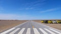 Nature landscape view of straight road in under sunny blue sky in Dunhuang UNESCO Global Geopark, Gansu China