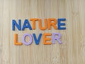 Nature lover sign on a wood background Royalty Free Stock Photo