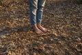 Nature massage. Barefoot foots on forest ground. Shoeless human legs at nature