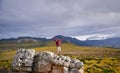 Nature, mountain and man with celebration for hiking, peak and journey with success and freedom outdoor. Trekking, rock Royalty Free Stock Photo