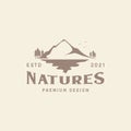 Nature mountain with tree and lake vintage outdoor logo symbol icon vector graphic design illustration idea creative