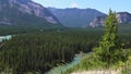 Nature mountains green landscape with Banff, Rocky mountain, Alberta, Canada. Sunny day, cloudy sky, mountains and forest