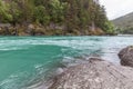 Nature of Norway. Mountain river with clear water. Rocky slope with a picturesque waterfall. Hiking in Norway. Scandinavian nature Royalty Free Stock Photo