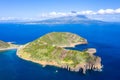 Extinct volcano craters of Caldeirinhas, mount Guia, Horta, Faial island with the peak of Pico volcanic mountain, Azores, Portugal Royalty Free Stock Photo