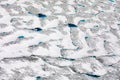 Thawing glacier surface aerial ice texture pattern