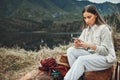 Nature, phone and young woman hiking on a mountain and network on social media or mobile app. Travel, technology and Royalty Free Stock Photo