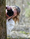 Nature photographer girl shooting you Royalty Free Stock Photo