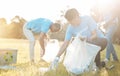 Nature recycling, community service volunteer and woman cleaning garbage, grass field trash or plastic pollution. Earth Royalty Free Stock Photo