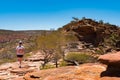 Girl tourist with a backpack hiking alone on Nature`s Window Loop Trail Royalty Free Stock Photo