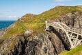 Nature scene of Mizen head Peninsula. Two beautiful women on Mizen bridge. Travel and holiday in Ireland concept