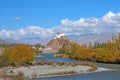Nature scene of Stakna monastery or gompa and blue river and fall foliage in autumn season with Himalayan mountians backgroud at