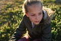 Nature, summer and girl sitting on the grass in a park after playing alone on vacation or weekend trip. Natural Royalty Free Stock Photo