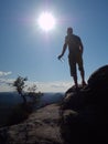 Nature trail runner in t-shirt and shorts watching lazy morning