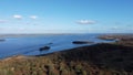 Nature view with wind turbines farm. Over water seen from the air.