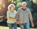 Nature, walk and a senior couple holding hands in park laughing and romance in retirement. Outdoor garden, love and Royalty Free Stock Photo