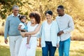 Nature, walking and family generations in a park for bonding, having fun and talking together. Happy, smile and child Royalty Free Stock Photo