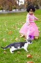 Nature, walking and girl with kitten in a garden on the grass on a summer weekend together. Happy, sunshine and portrait Royalty Free Stock Photo