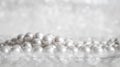 Nature white pearl beads on sparkling background Royalty Free Stock Photo