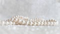 Nature white pearl beads on sparkling background Royalty Free Stock Photo