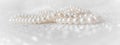 Nature white pearl beads on sparkling background Royalty Free Stock Photo