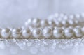 Nature white pearl beads on sparkling background Royalty Free Stock Photo