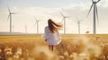 Nature woman turbine back wind energy run ecology technology generate electricity Royalty Free Stock Photo