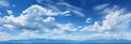 Natures canvas: serene panorama of blue sky and drifting white clouds Royalty Free Stock Photo