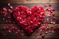 Natures love heart crafted from rose petals on wood Royalty Free Stock Photo