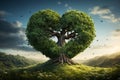 Natures love heart shaped tree flourishes amidst lush green grass Royalty Free Stock Photo