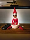 Naught Christmas Elf Eating Popcorn on Christmas Eve Royalty Free Stock Photo