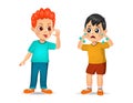 Boy showing grimace face to boy until he cry Royalty Free Stock Photo