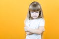 Naughty child. Disobedience problem. discipline punishment. Portrait of cute angry offended little girl in white with crossed arms Royalty Free Stock Photo