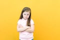 Naughty child. Disobedience problem. discipline punishment. Portrait of cute angry offended little girl in white with crossed arms Royalty Free Stock Photo