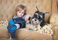 Naughty child and schnauzer puppy